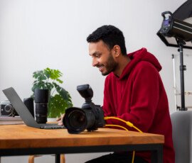 Media Center medium shot specialized photographer working studio